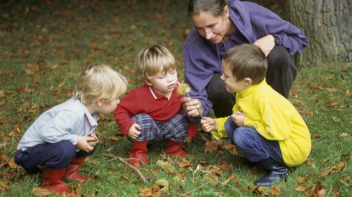 Family looking at a conker